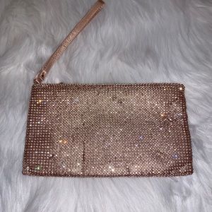 Gorgeous NWT rose gold bling evening bag/wristlet, top zip closure